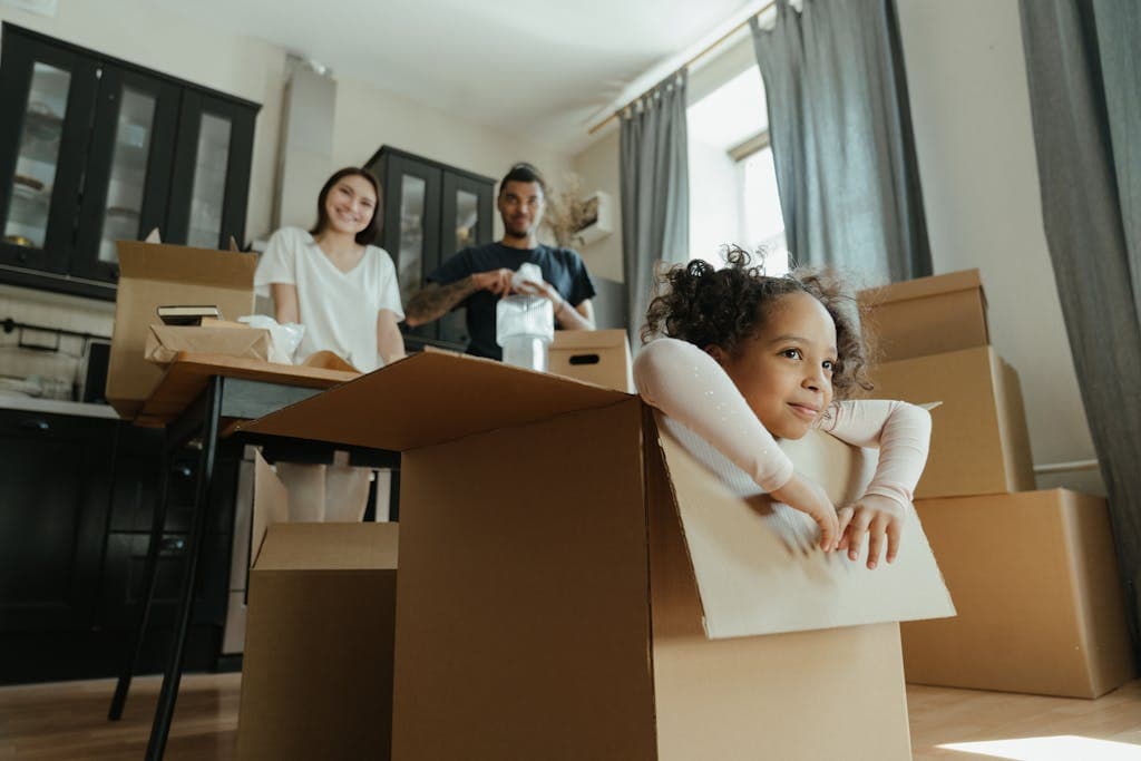Little Girl Playing in a moving box